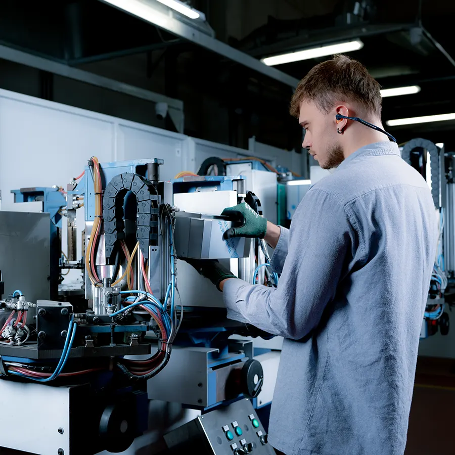 A worker assembling an enclosure